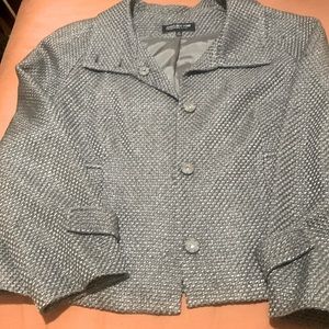 Women’s jacket grey in color. In excellent condition.